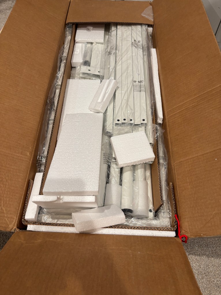 Box of bed frame pieces